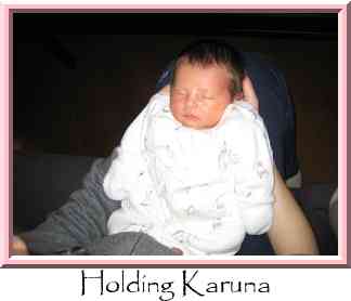 Holding Karuna Thumbnail
